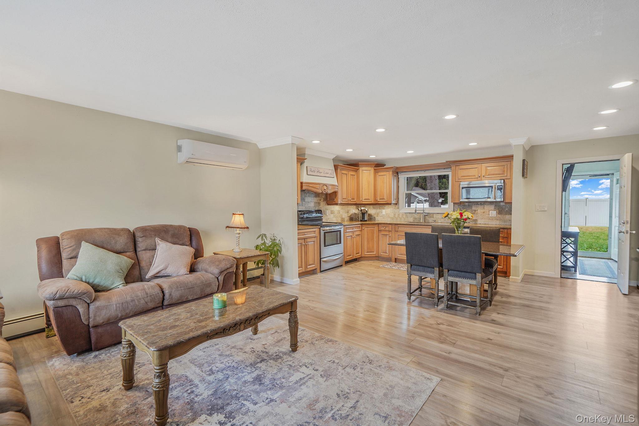 11 Nehring Avenue Babylon, NY 11702 - Photo 5 of 27 a living room with furniture and view of kitchen