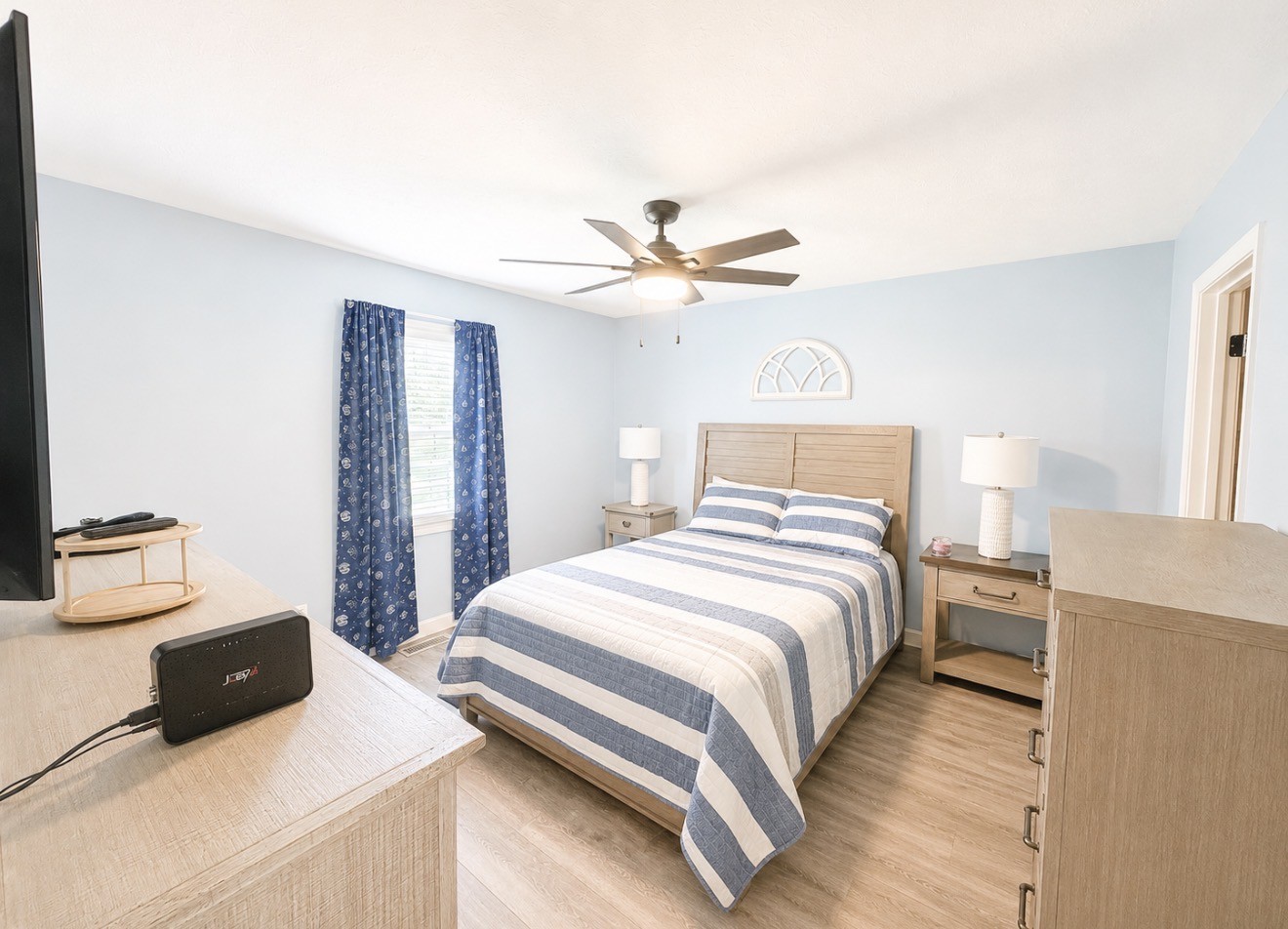 153 Henry Harris Road Westmoreland, TN 37186 - Photo 10 of 18 a bedroom with a bed and a ceiling fan