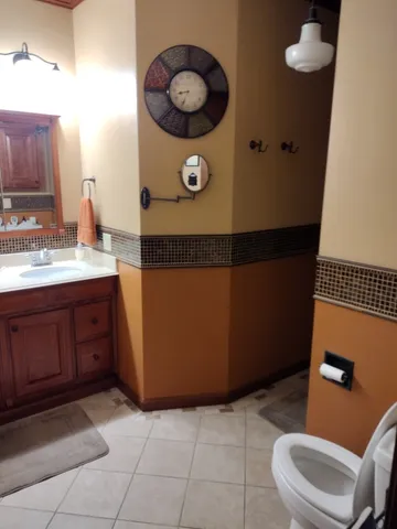 a view of walk in closet with wooden floor