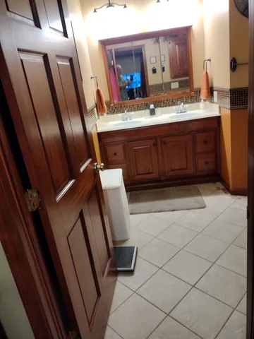 a bathroom with a sink and a mirror