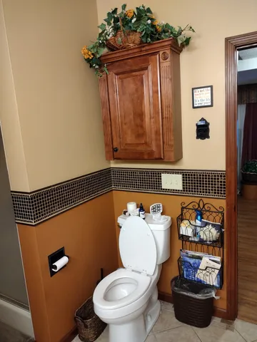 a bathroom with a toilet and a sink
