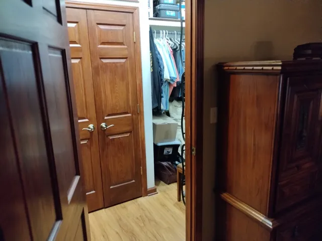 a bedroom with a bed and dresser