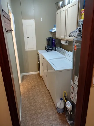 a bedroom with a bed and a mirror on the dresser