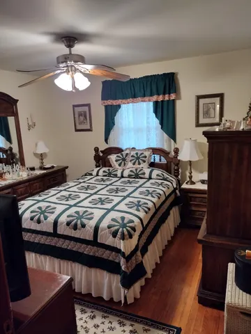 a backyard of a house with yard table and chairs