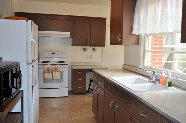 1709 Upper River Road Macon, GA 31211 - Photo 3 of 34 a kitchen with a sink stove top oven and cabinets