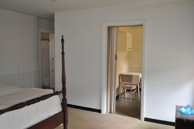 1709 Upper River Road Macon, GA 31211 - Photo 22 of 34 a bedroom with a bed and a table