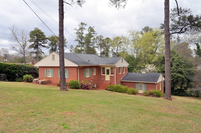1709 Upper River Road Macon, GA 31211 - Photo 34 of 34 a front view of a house with a yard and garage