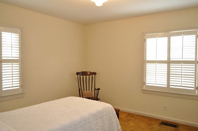 1709 Upper River Road Macon, GA 31211 - Photo 9 of 34 a bedroom with a bed and a window