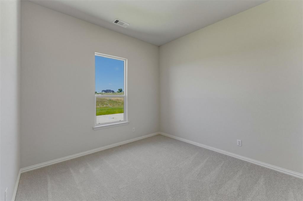 114 Hillview Trail Decatur, TX 76234 - Photo 14 of 27 Room with light gray wall paint, white baseboards, and carpeted flooring