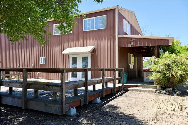 a view of a lake with a tree in the background
