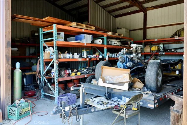 a reading room with furniture and book shelf