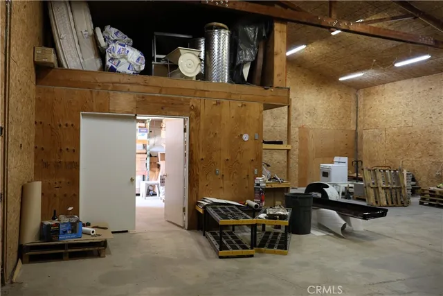 a view of a chairs and table in the patio