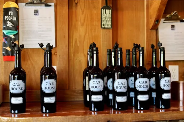 a view of a patio with a table and chairs under an umbrella