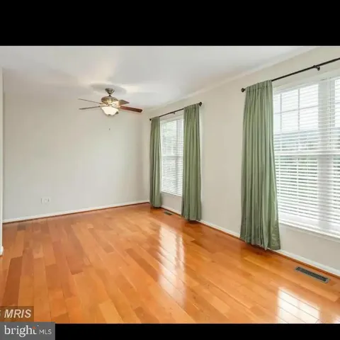 a view of an empty room with windows