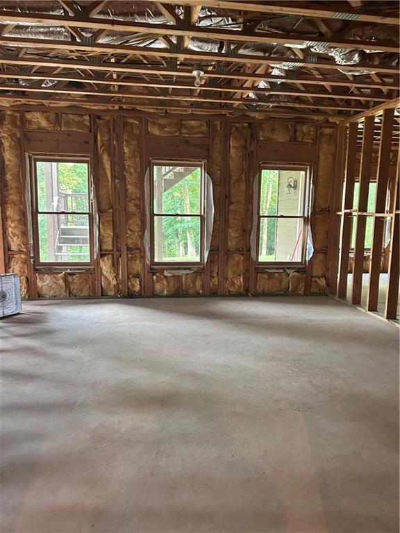 348 Hidden Trail Pendergrass, GA 30567 - Photo 38 of 40 an empty room with a fireplace and windows