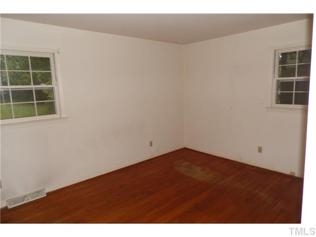 2909 Gladstone Drive Raleigh, NC 27610 - Photo 5 of 10 a view of empty room with windows