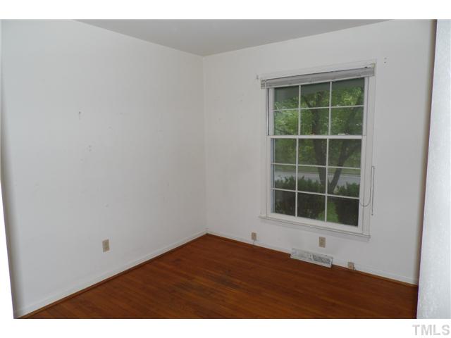 2909 Gladstone Drive Raleigh, NC 27610 - Photo 7 of 10 a view of an empty room with a window