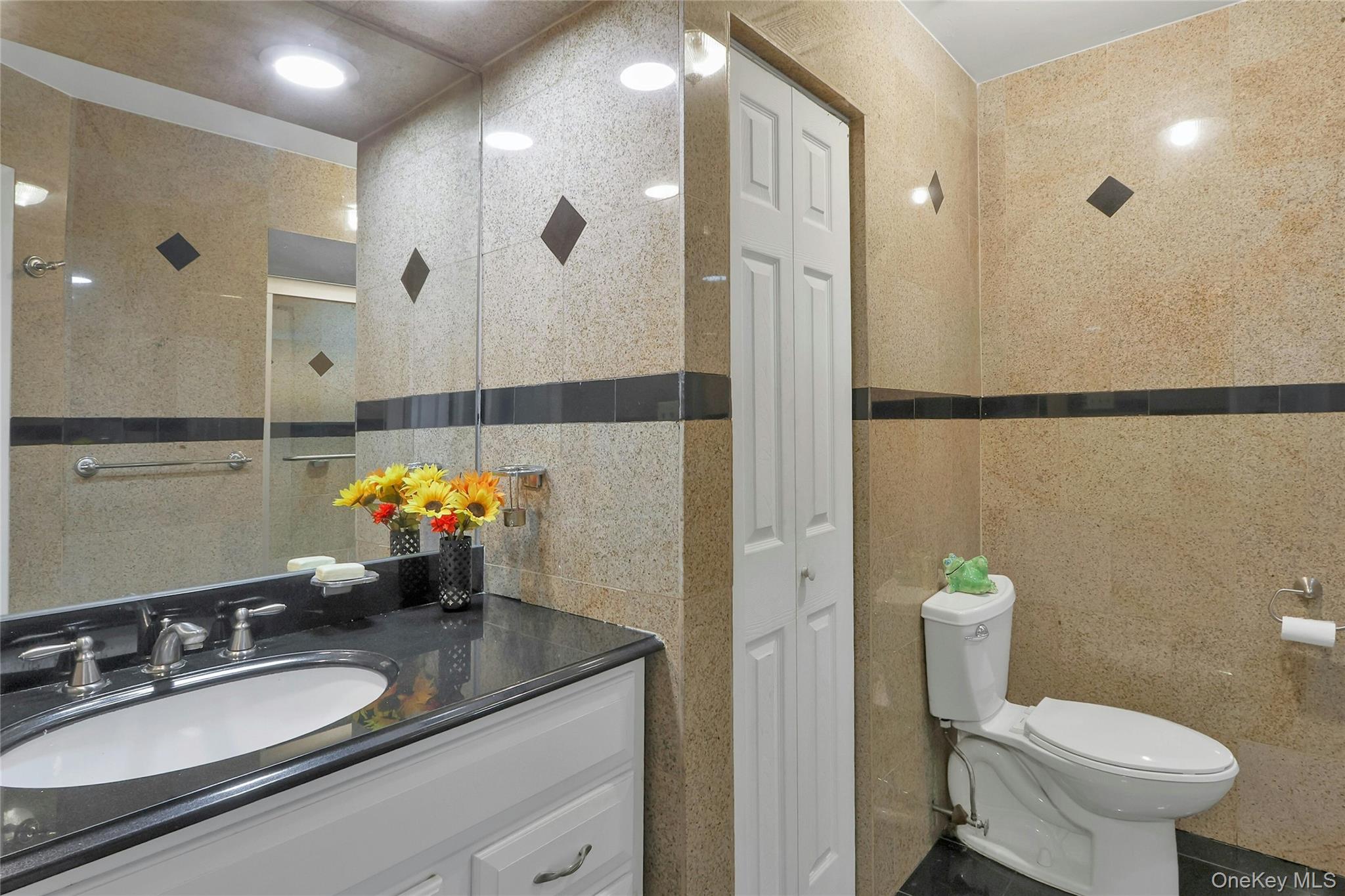 8 Windmill Lane New City, NY 10956 - Photo 14 of 33 a bathroom with a sink double vanity and a shower