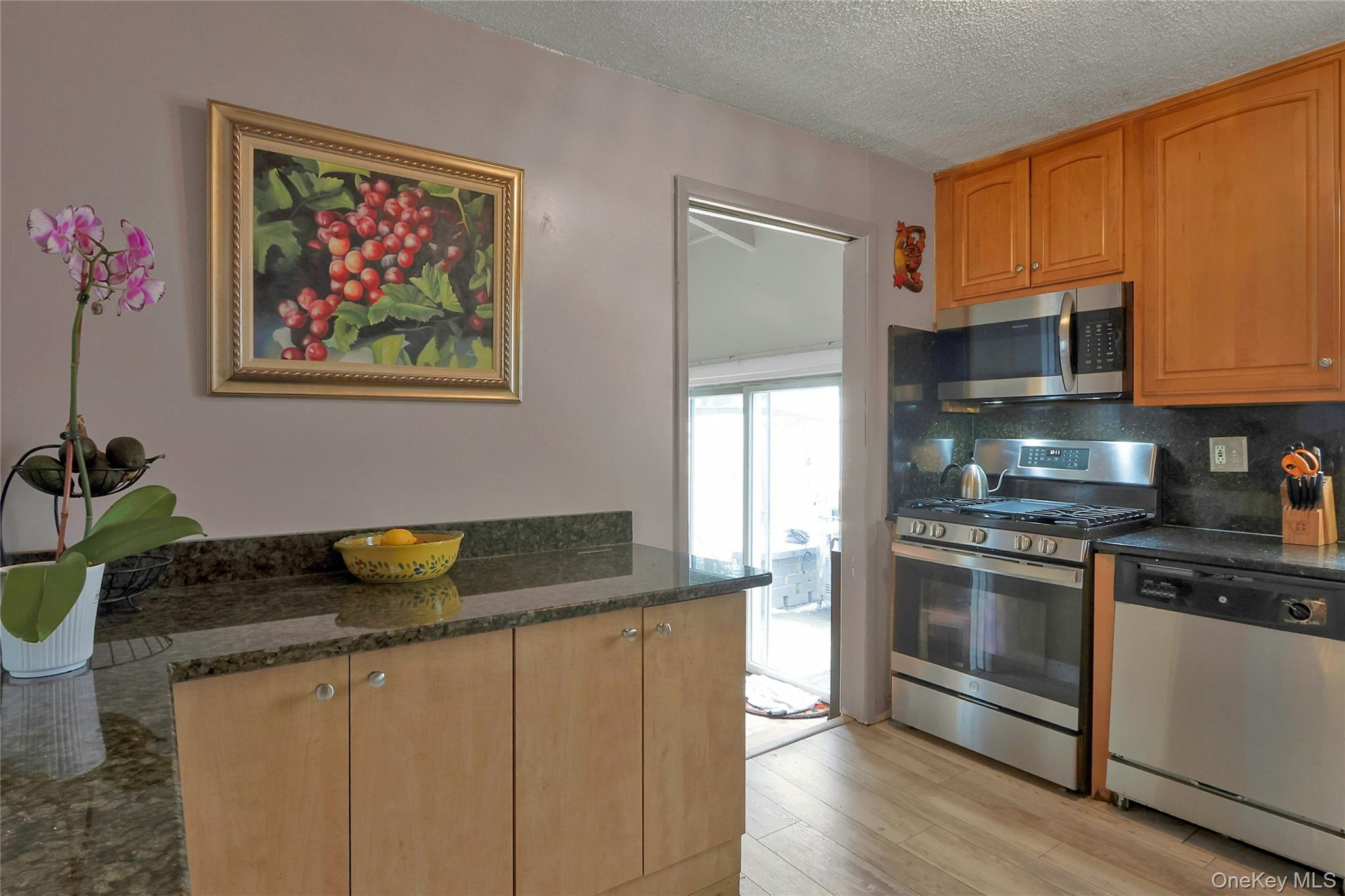 8 Windmill Lane New City, NY 10956 - Photo 6 of 33 a kitchen with stainless steel appliances granite countertop a stove a sink and a refrigerator