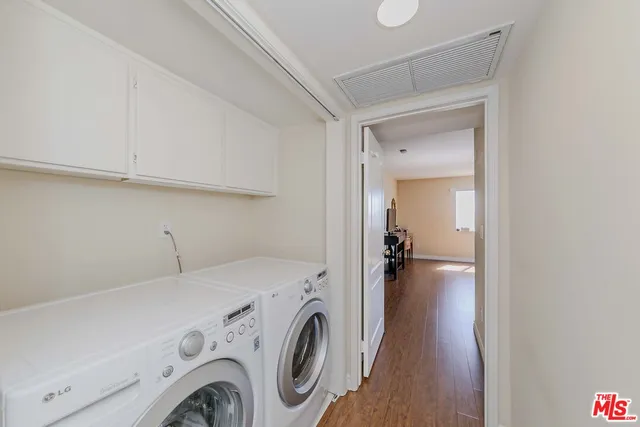 a view of storage and utility room with washer and dryer