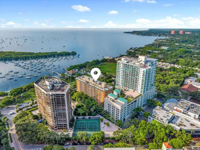 an aerial view of a building with outdoor space and street view