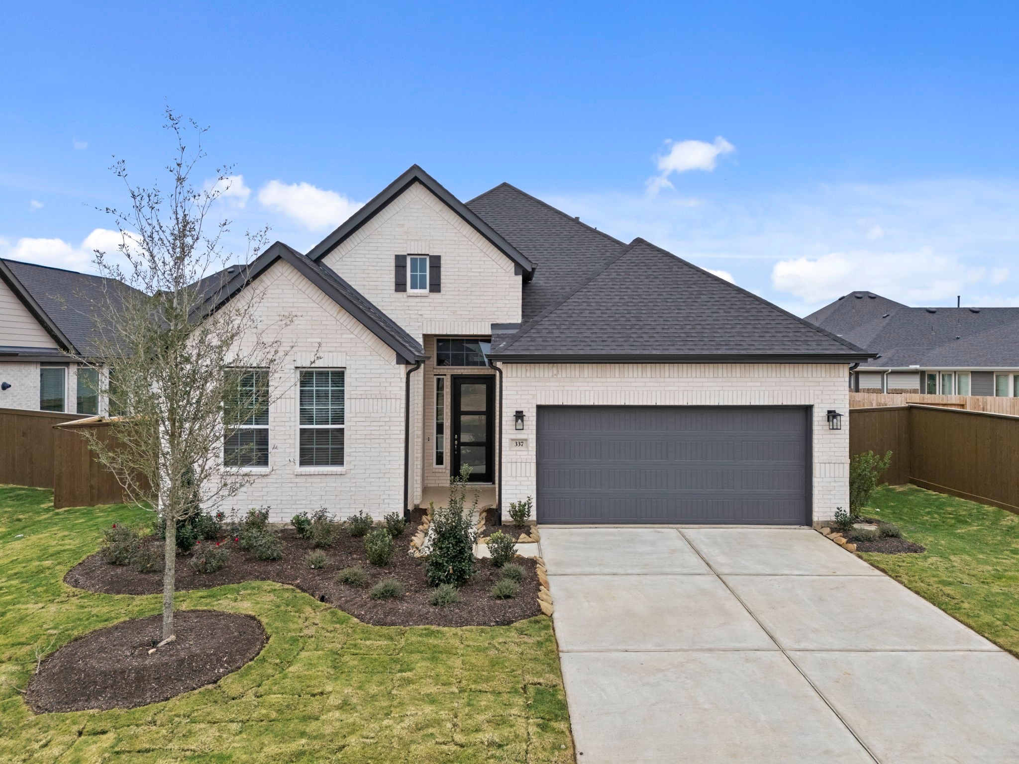 337 Gambels Quail Road Waller, TX 77484 - Photo 2 of 35 a front view of a house with garden