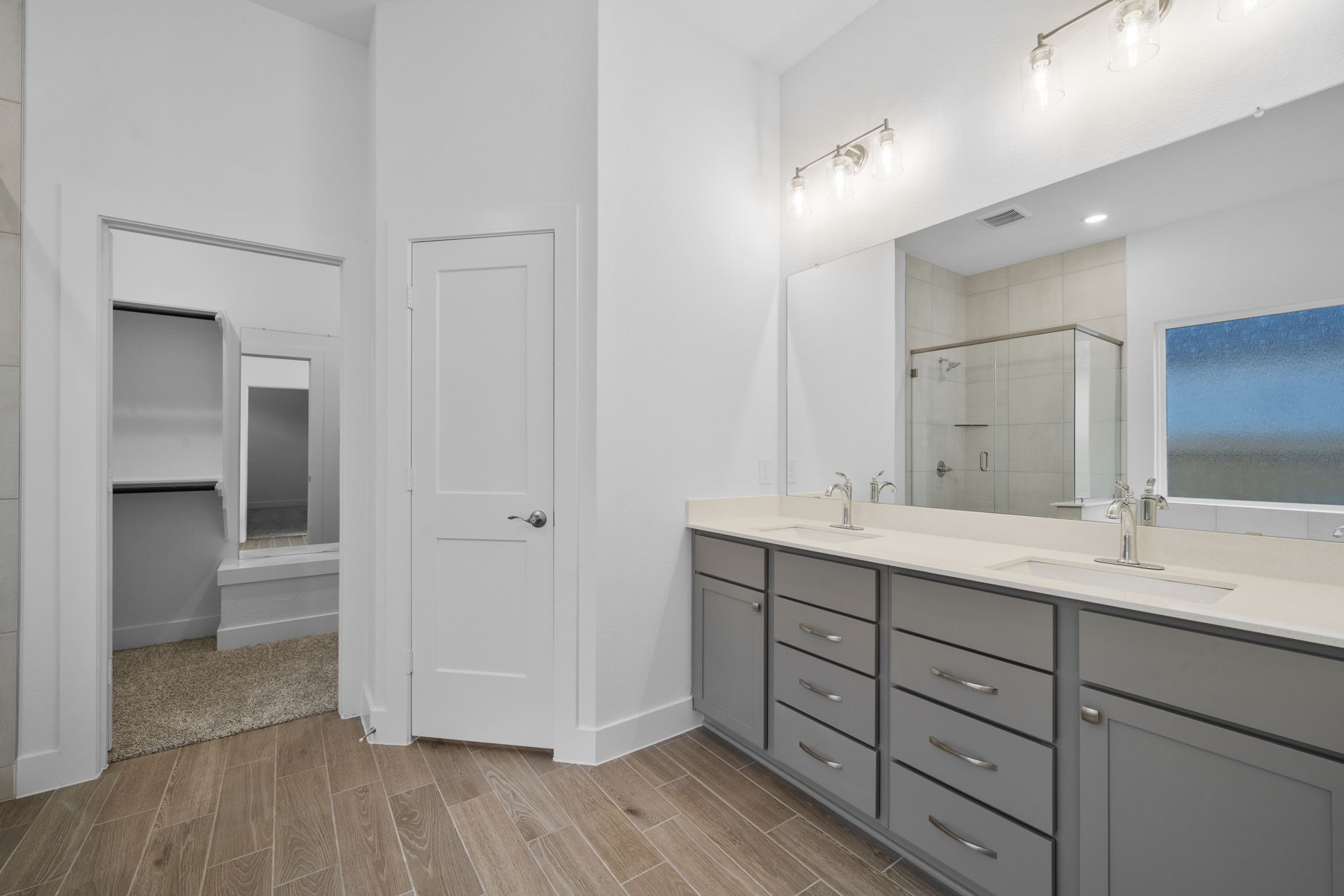 337 Gambels Quail Road Waller, TX 77484 - Photo 22 of 35 a bathroom with a double vanity sink and mirror