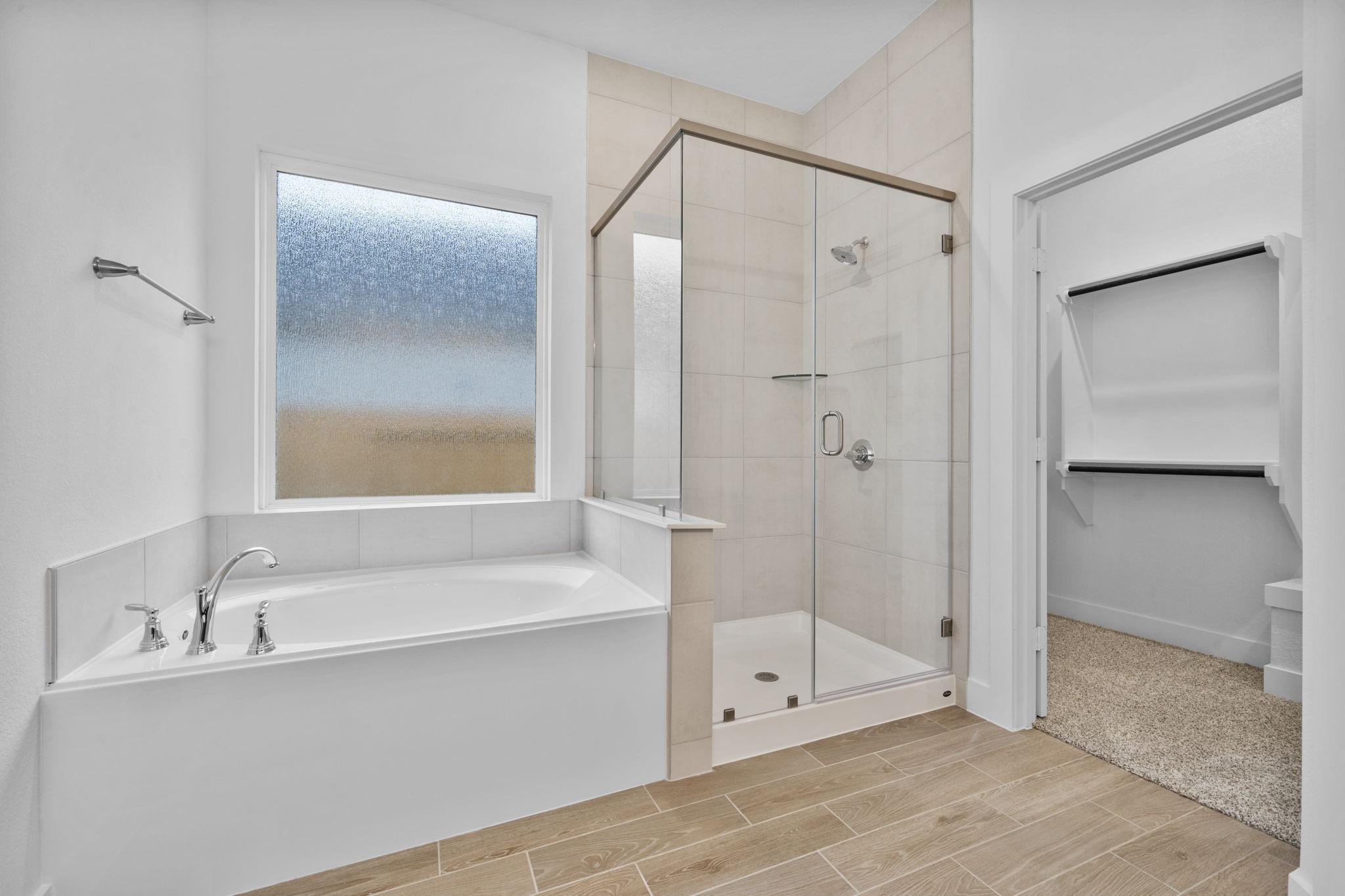337 Gambels Quail Road Waller, TX 77484 - Photo 23 of 35 a bathroom with a bathtub and a shower