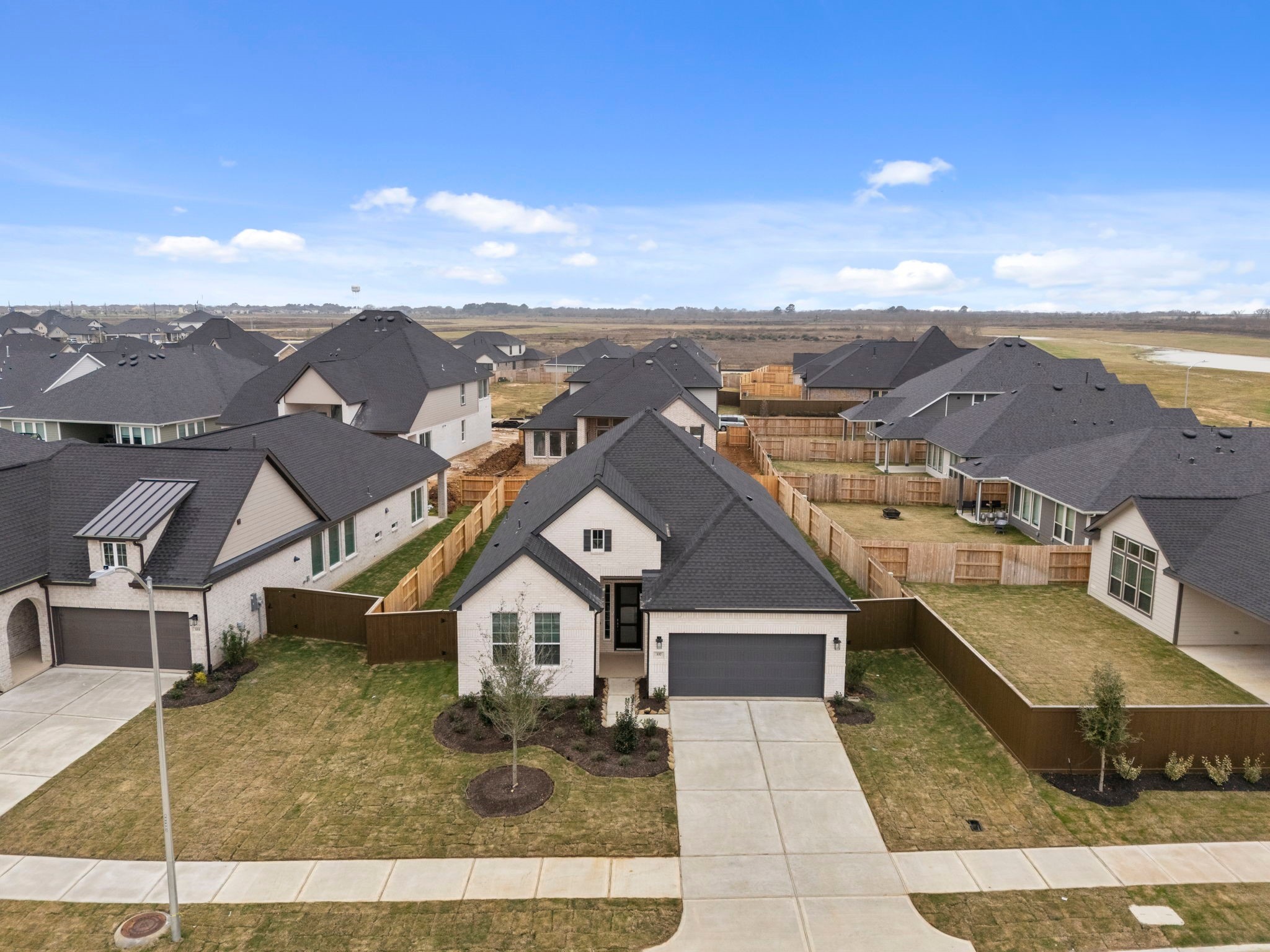 337 Gambels Quail Road Waller, TX 77484 - Photo 30 of 35 an aerial view of a house with a yard