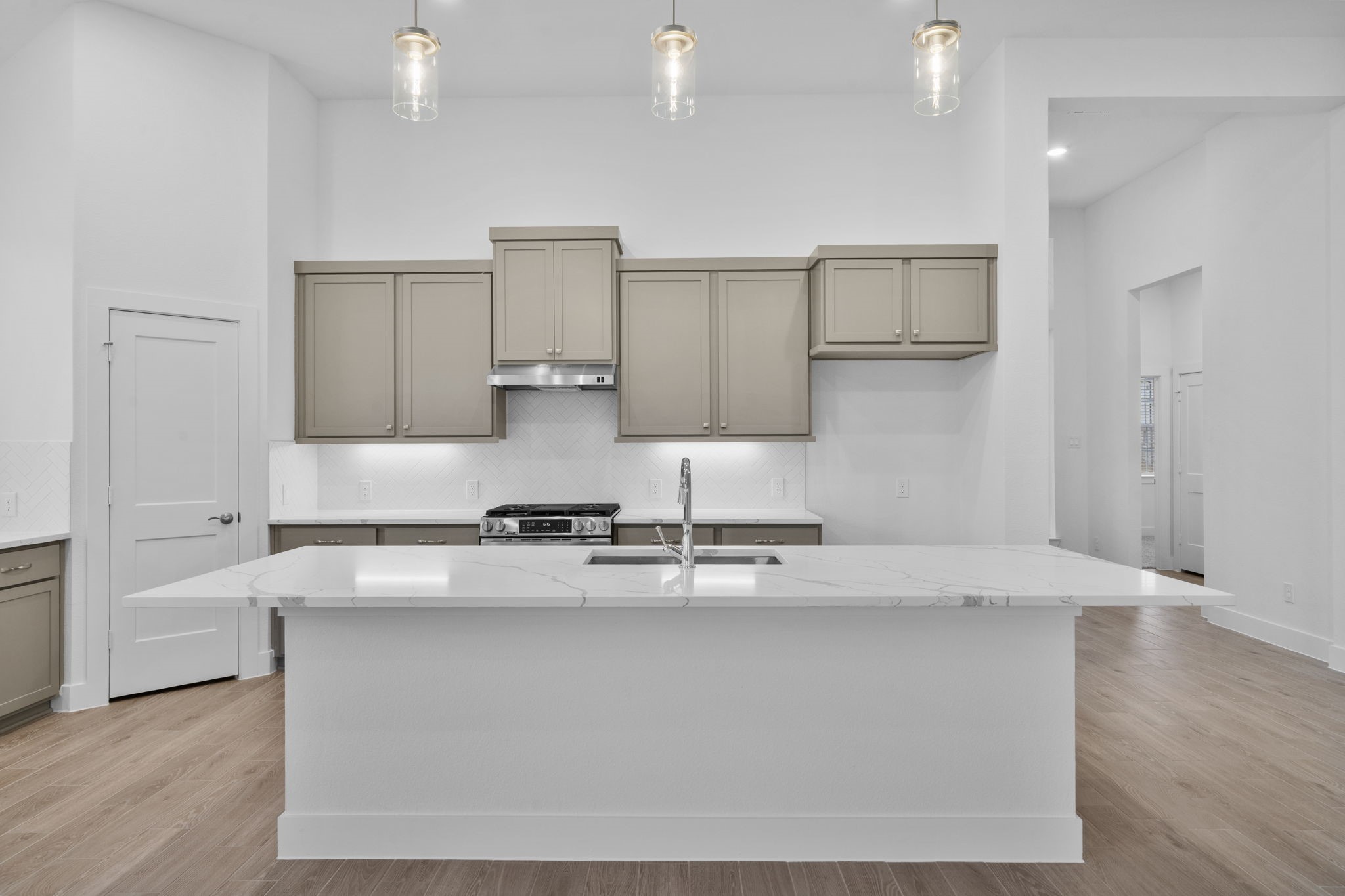 337 Gambels Quail Road Waller, TX 77484 - Photo 4 of 35 a kitchen with stainless steel appliances granite countertop a sink a stove and a refrigerator
