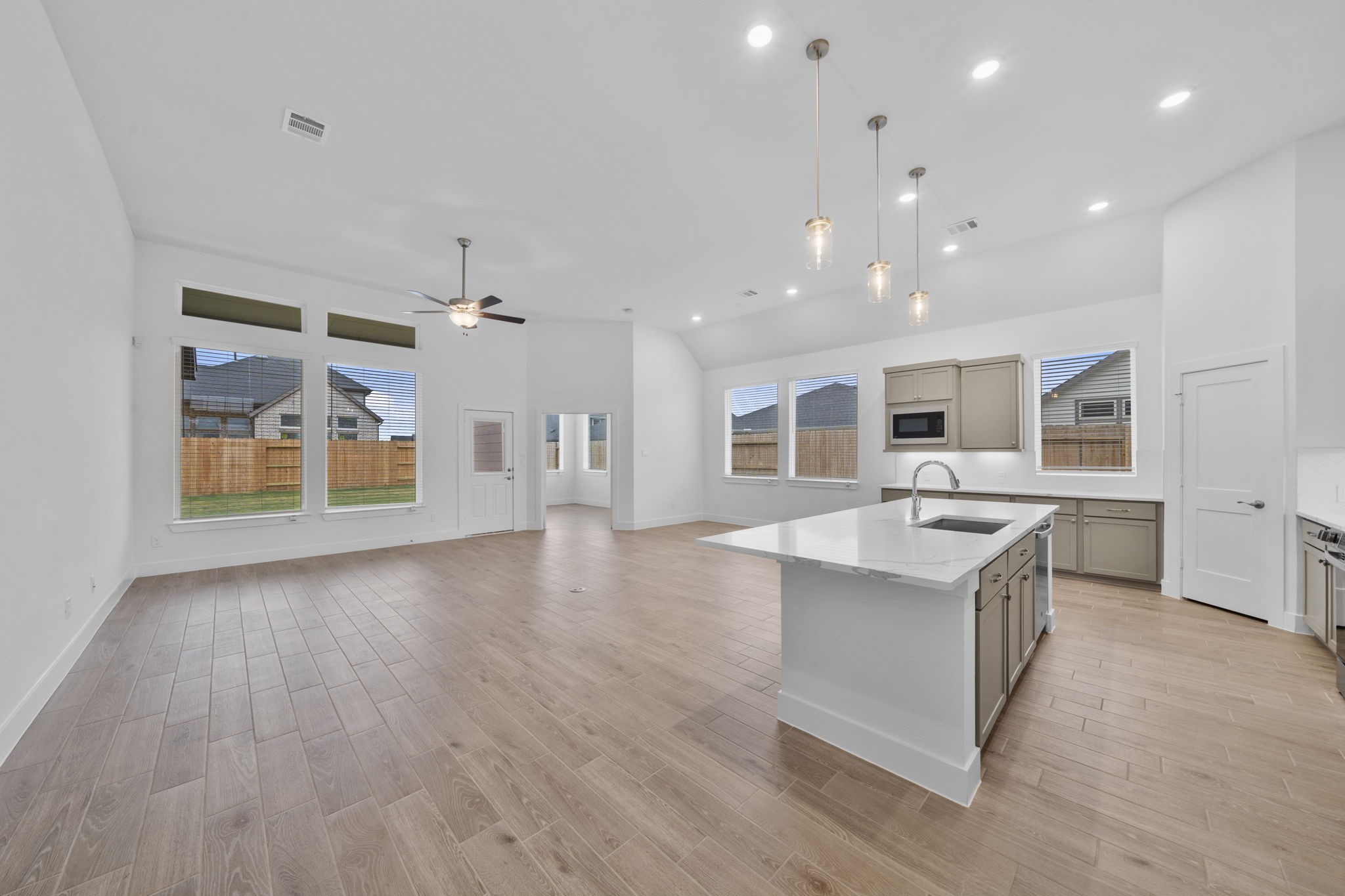 337 Gambels Quail Road Waller, TX 77484 - Photo 8 of 35 a large kitchen with stainless steel appliances granite countertop a large center island and a sink