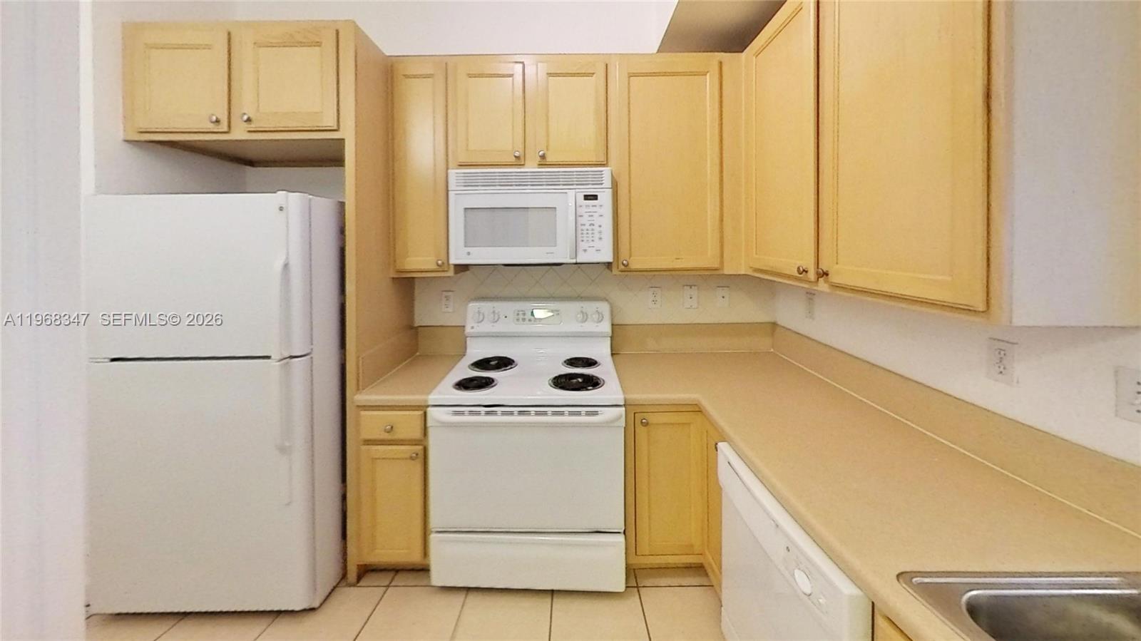 6001 Southwest 70th Street, Unit 217 South Miami, FL 33143 - Photo 17 of 21 a utility room with dryer and washer