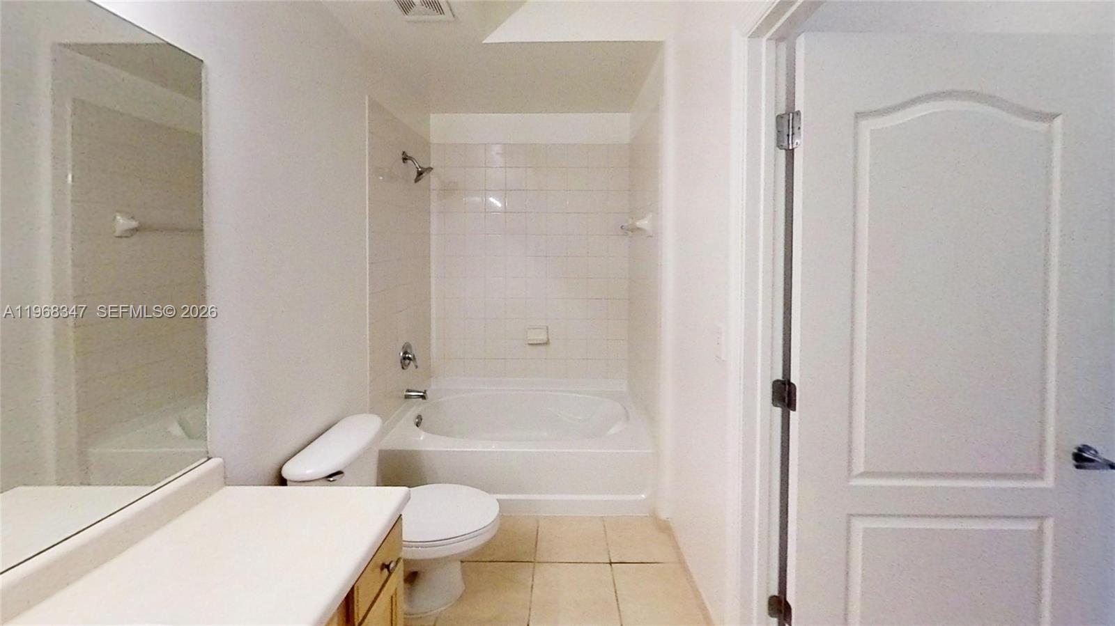 6001 Southwest 70th Street, Unit 217 South Miami, FL 33143 - Photo 18 of 21 a bathroom with a toilet and shower