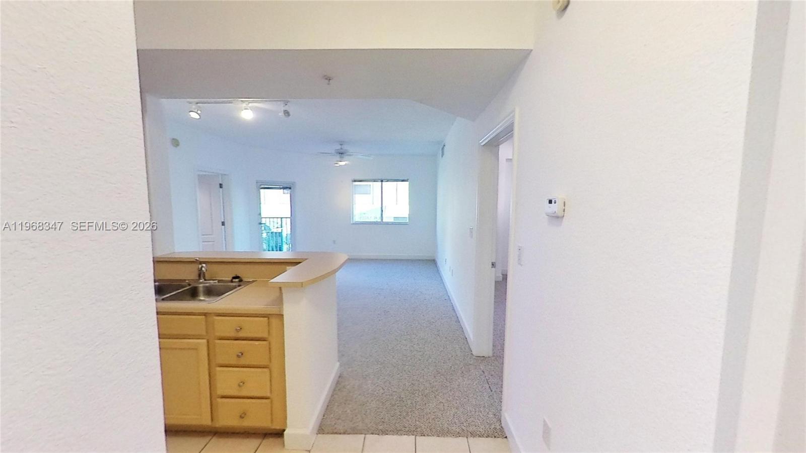 6001 Southwest 70th Street, Unit 217 South Miami, FL 33143 - Photo 19 of 21 a view of a hallway to a house