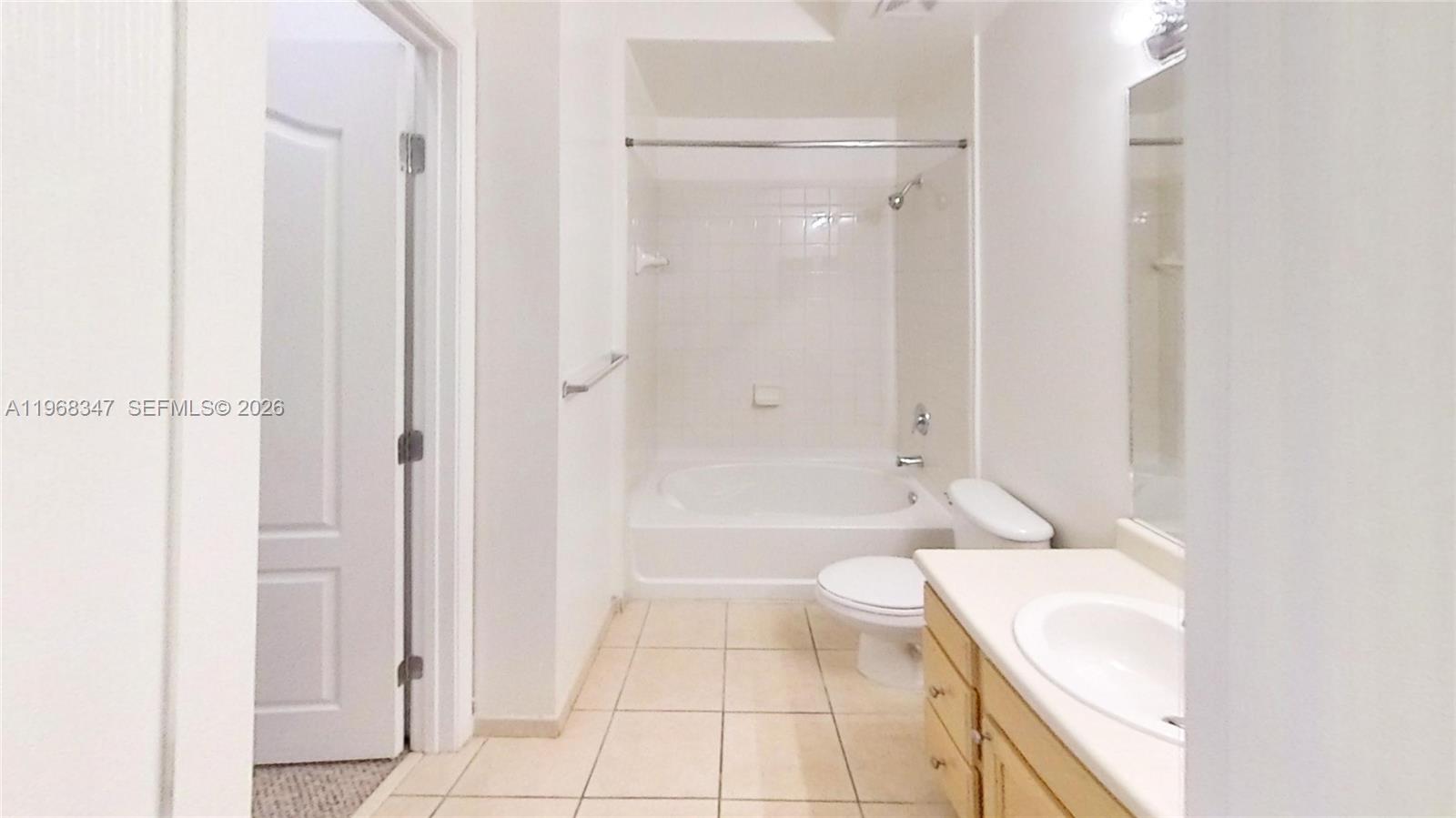 6001 Southwest 70th Street, Unit 217 South Miami, FL 33143 - Photo 20 of 21 a bathroom with a sink a toilet and shower