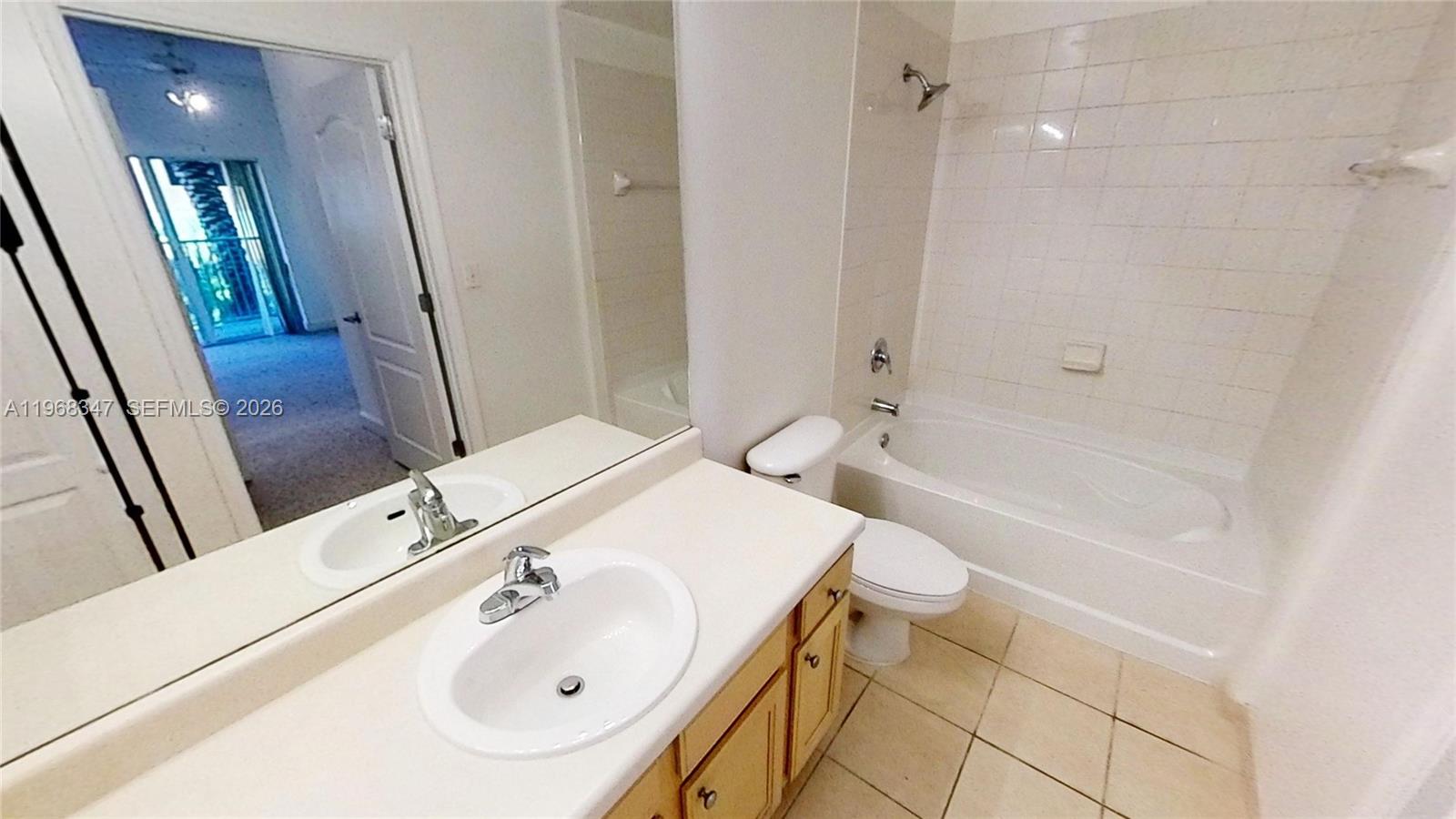 6001 Southwest 70th Street, Unit 217 South Miami, FL 33143 - Photo 2 of 21 a bathroom with a sink a toilet and shower