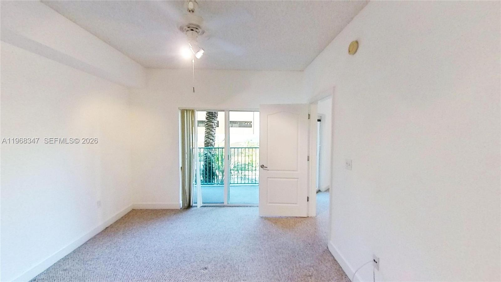 6001 Southwest 70th Street, Unit 217 South Miami, FL 33143 - Photo 3 of 21 an empty room with windows