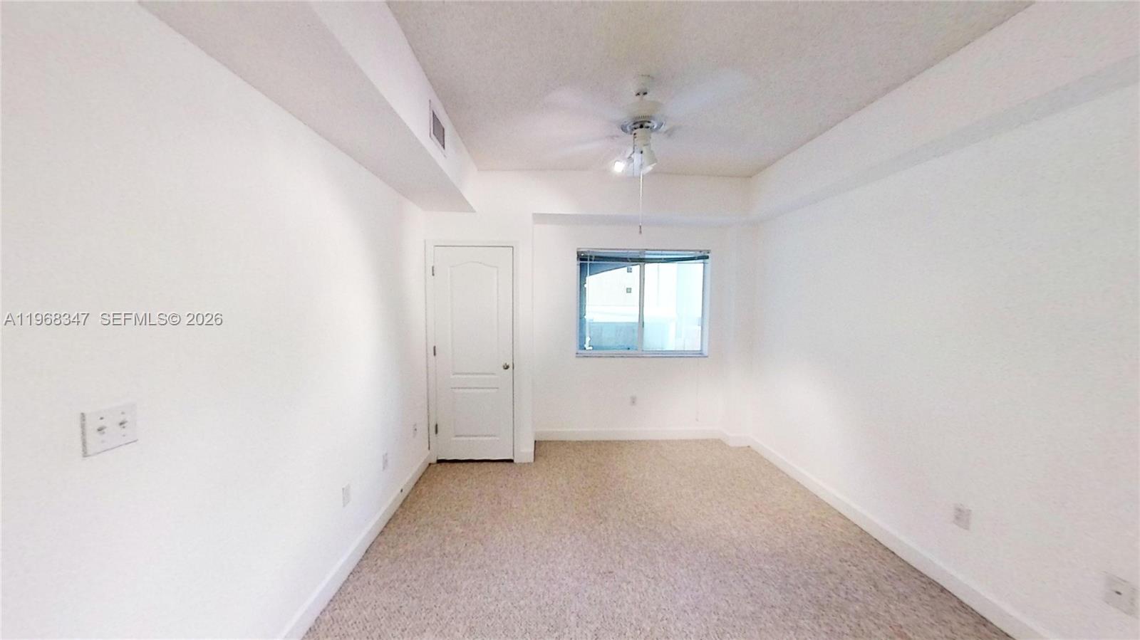 6001 Southwest 70th Street, Unit 217 South Miami, FL 33143 - Photo 7 of 21 an empty room with a empty space and windows