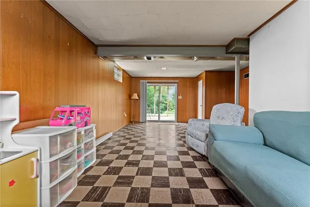 a bedroom with furniture and a window