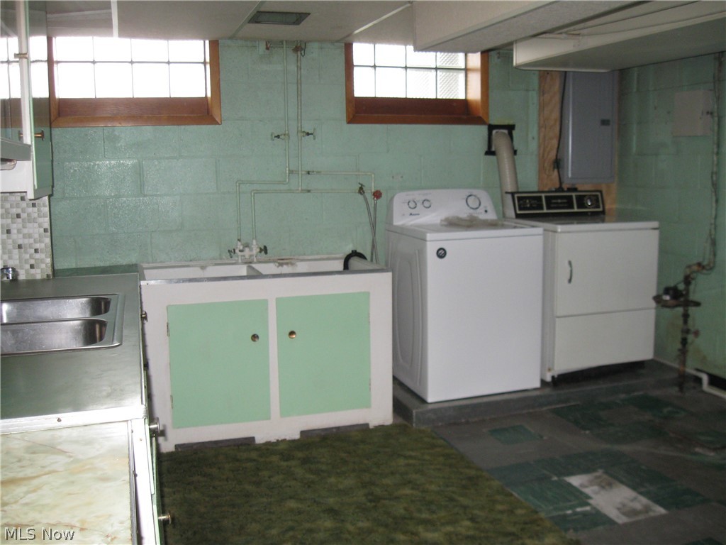 6154 State Road Parma, OH 44134 - Photo 21 of 35 Laundry area in basement. Entire basement has glass block windows.