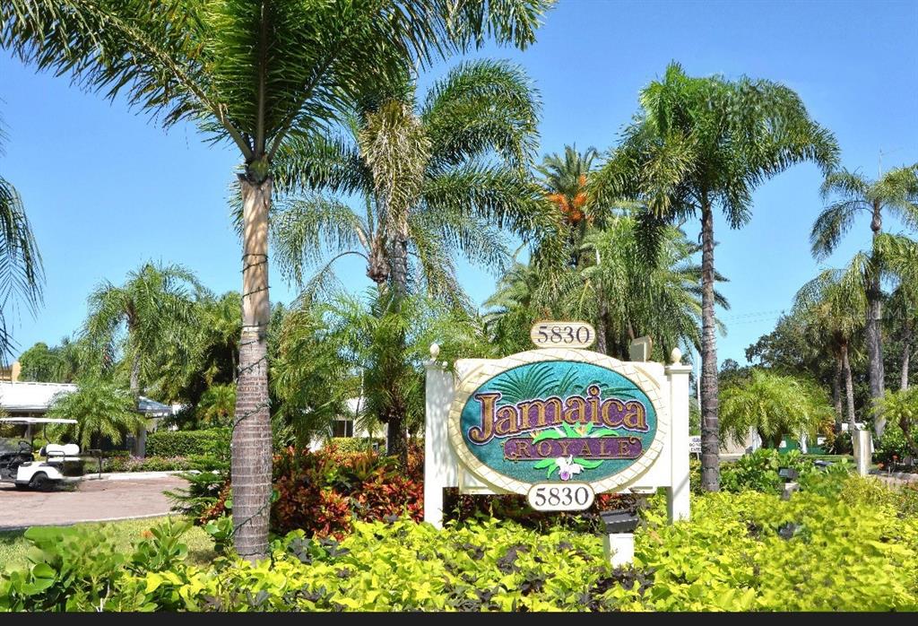 5830 Midnight Pass Road, Unit 94 Sarasota, FL 34242 - Photo 20 of 36 an aerial view of a house with garden space and swimming pool