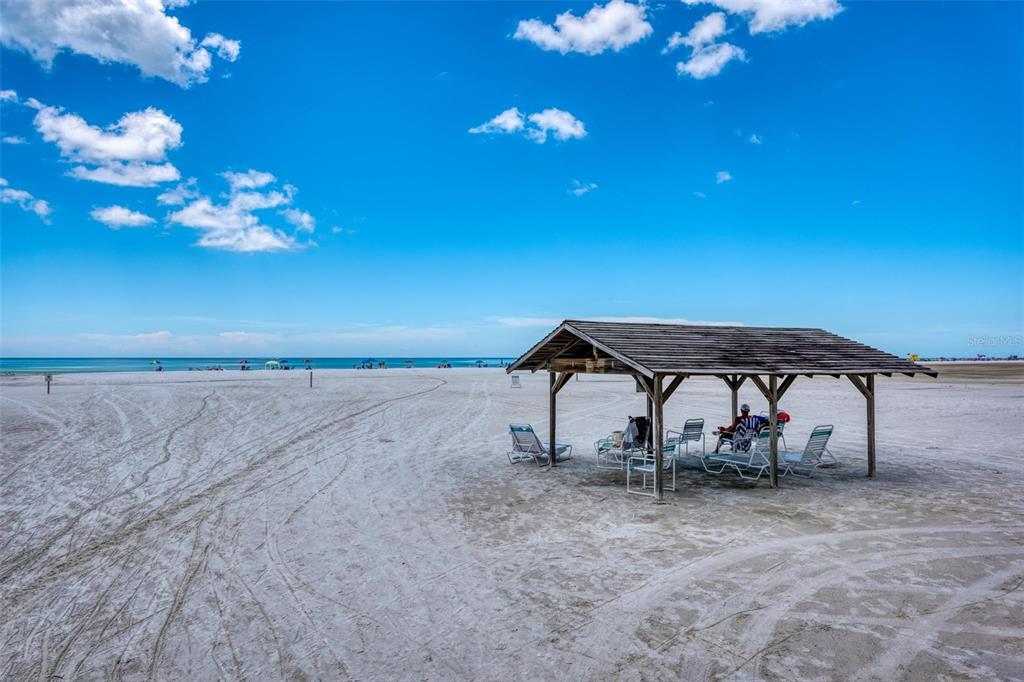 5830 Midnight Pass Road, Unit 94 Sarasota, FL 34242 - Photo 29 of 36 a backyard of a house with table and chairs