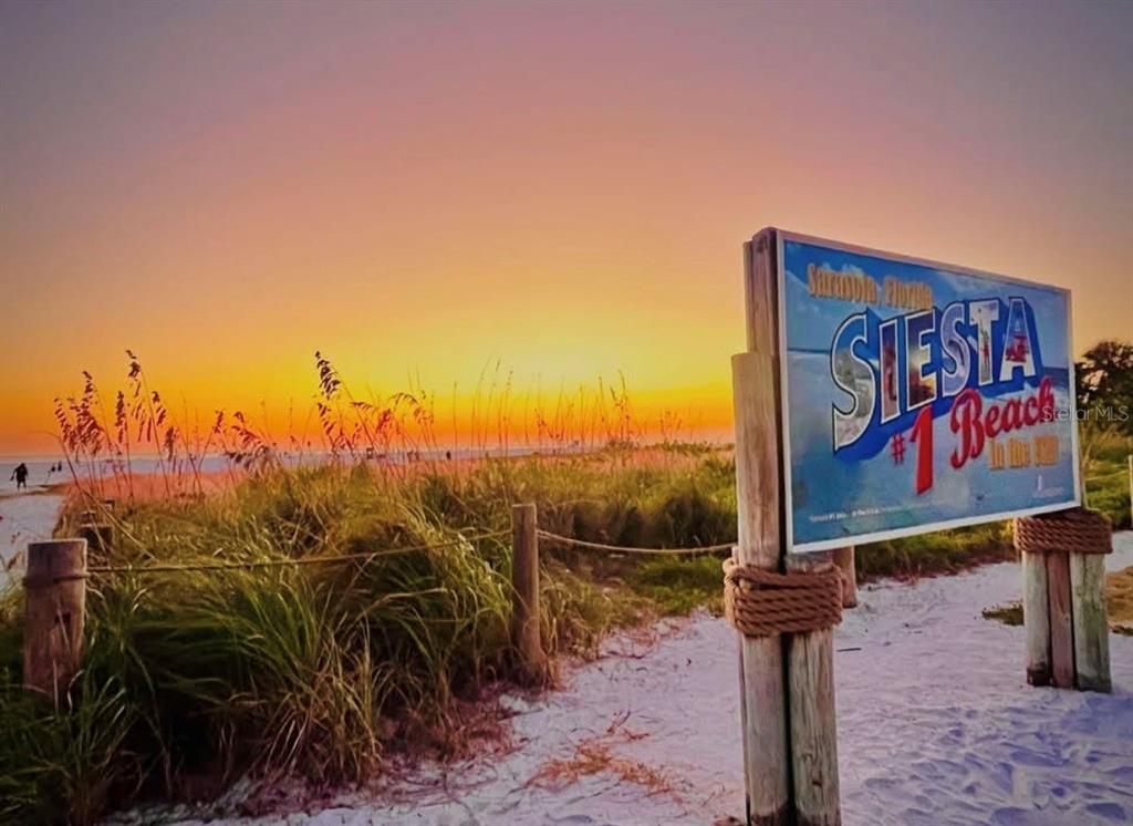 5830 Midnight Pass Road, Unit 94 Sarasota, FL 34242 - Photo 35 of 36 a sign on the side of a road