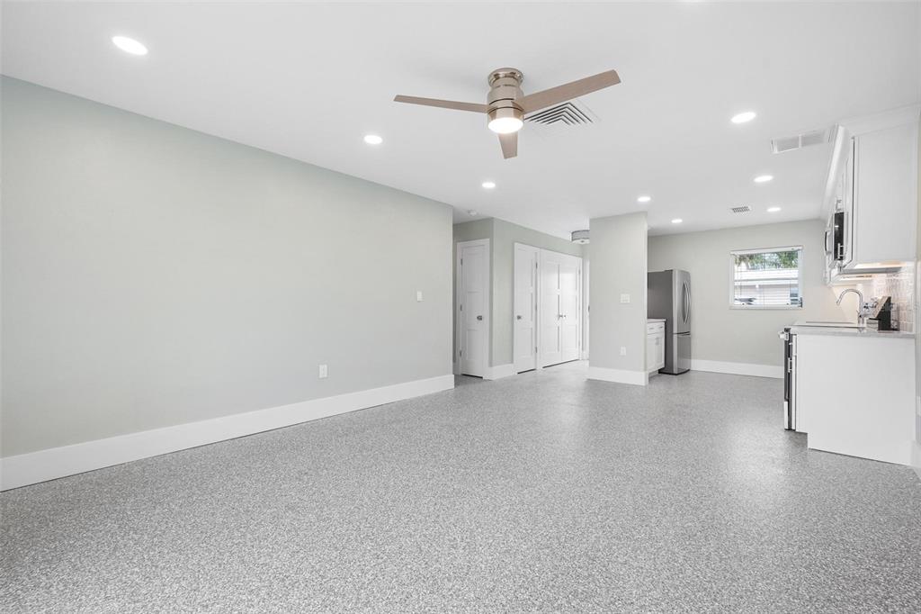 5830 Midnight Pass Road, Unit 94 Sarasota, FL 34242 - Photo 9 of 36 a view of a livingroom with a kitchen