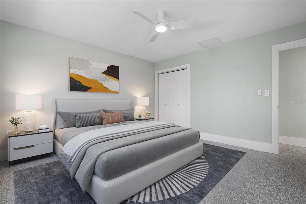 5830 Midnight Pass Road, Unit 94 Sarasota, FL 34242 - Photo 10 of 36 a bedroom with a bed and painting on the wall