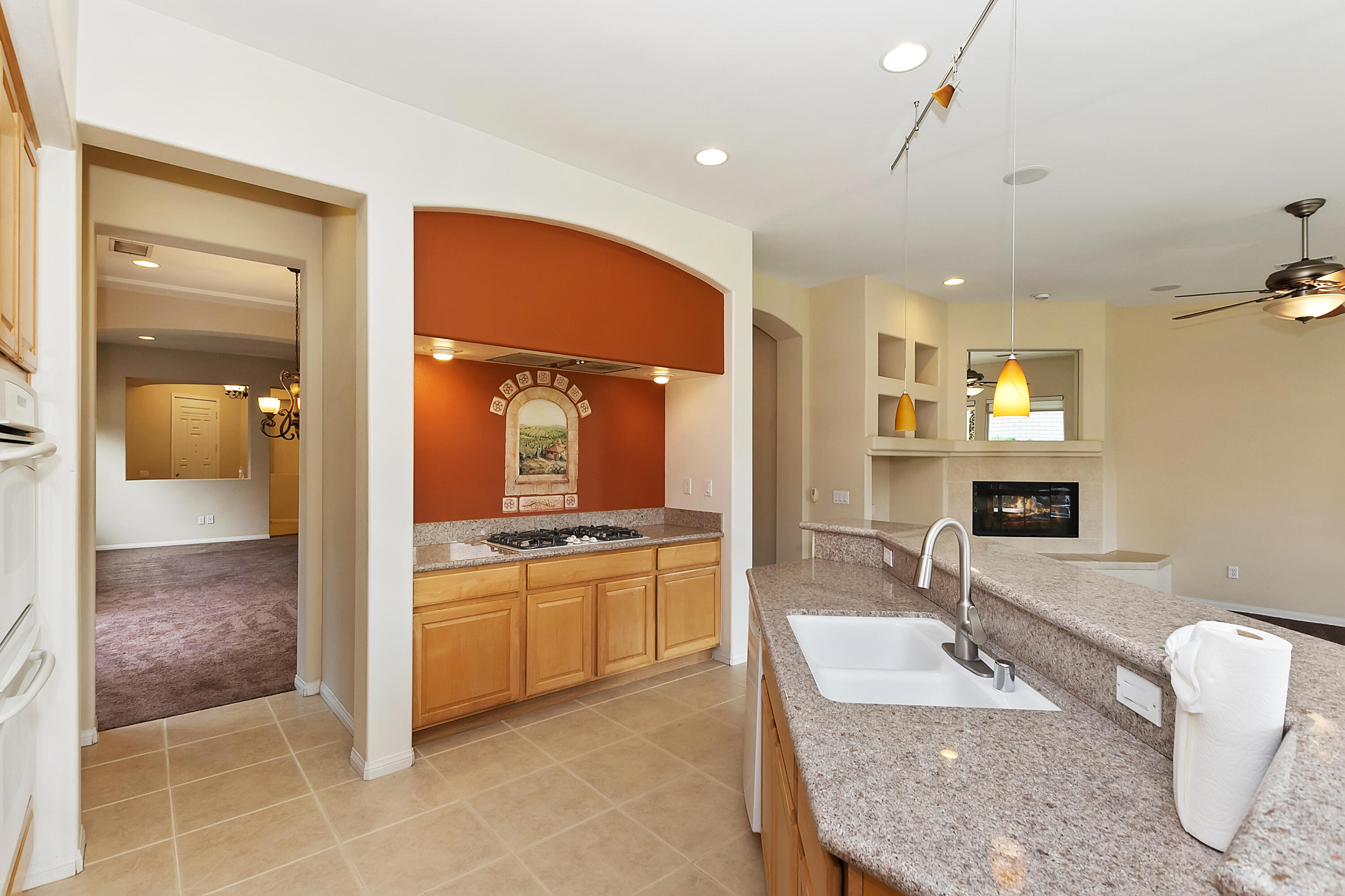 134 Via Tuscany Rancho Mirage, CA 92270 - Photo 12 of 44 a bathroom with a granite countertop sink and a mirror