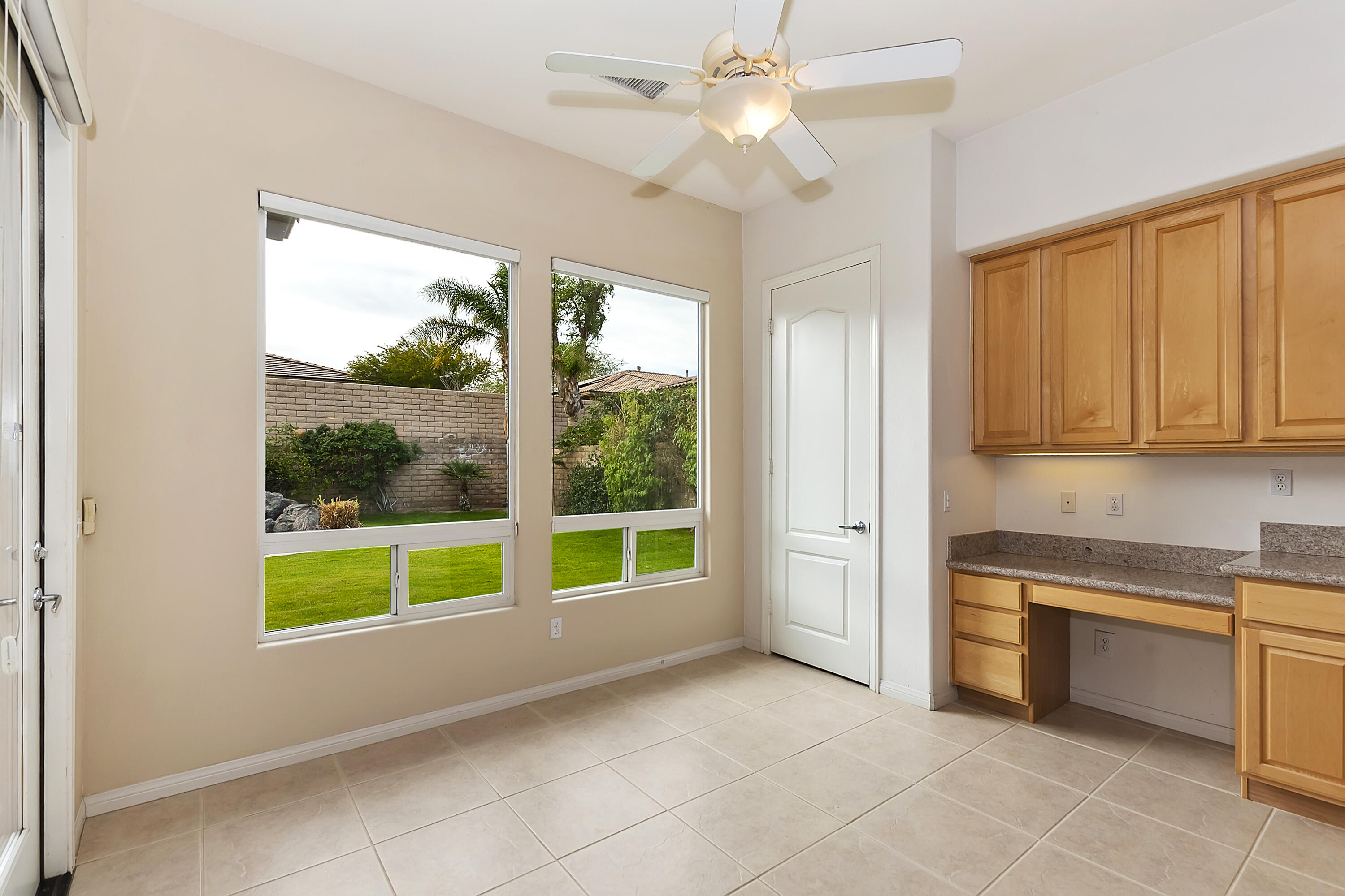 134 Via Tuscany Rancho Mirage, CA 92270 - Photo 14 of 44 a view of a kitchen with microwave and windows