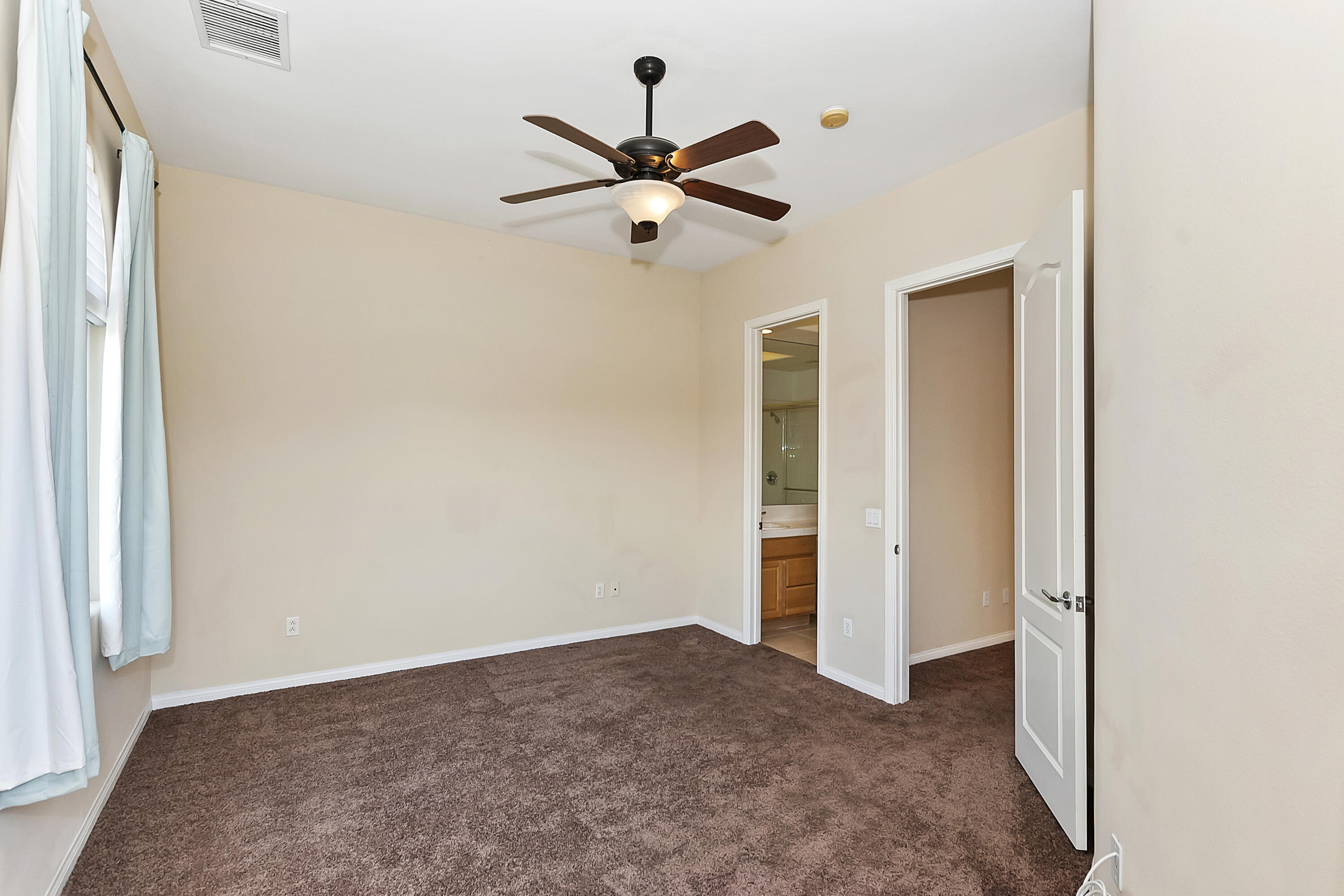 134 Via Tuscany Rancho Mirage, CA 92270 - Photo 19 of 44 a view of empty room with ceiling fan