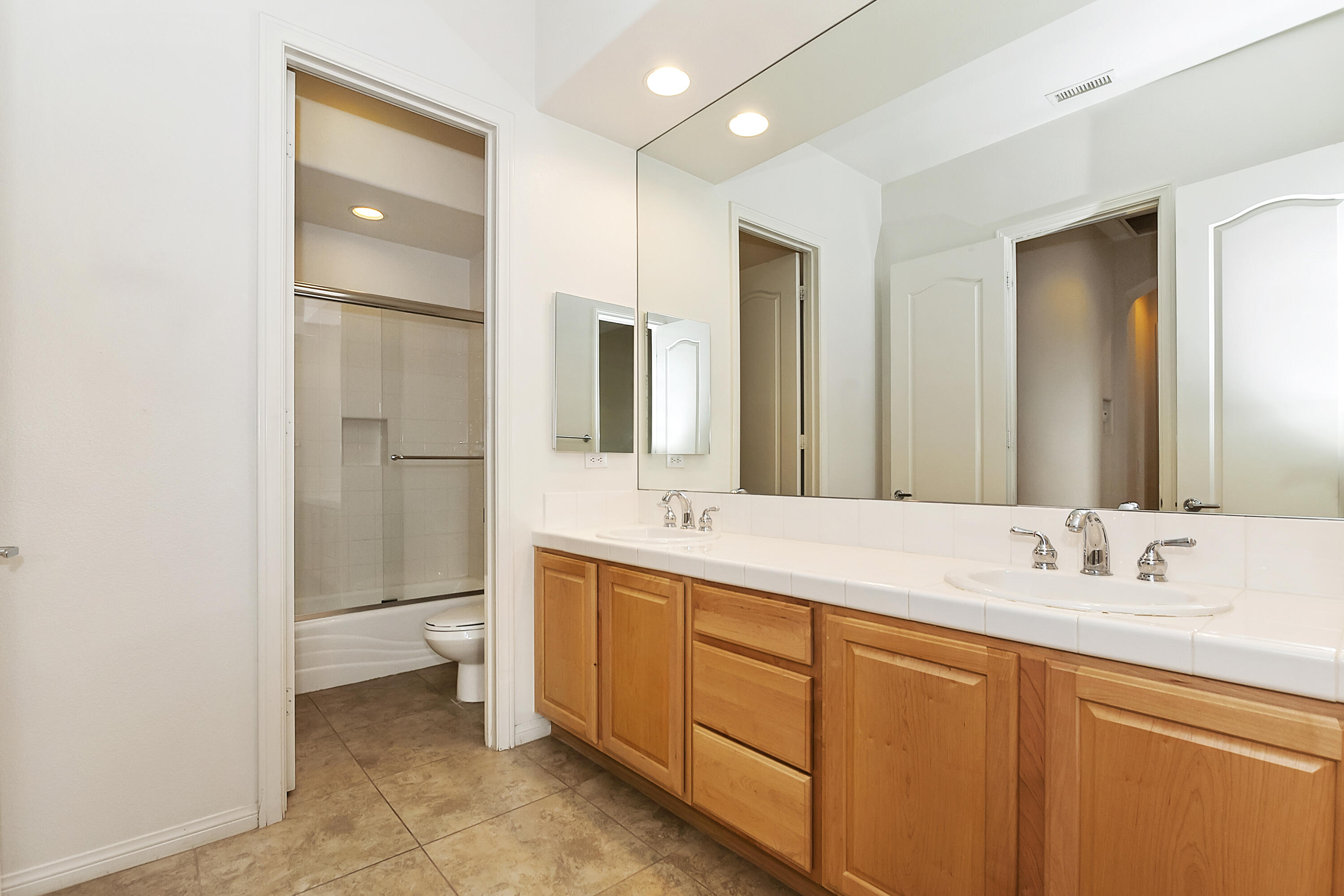 134 Via Tuscany Rancho Mirage, CA 92270 - Photo 24 of 44 a bathroom with a sink double vanity and a mirror