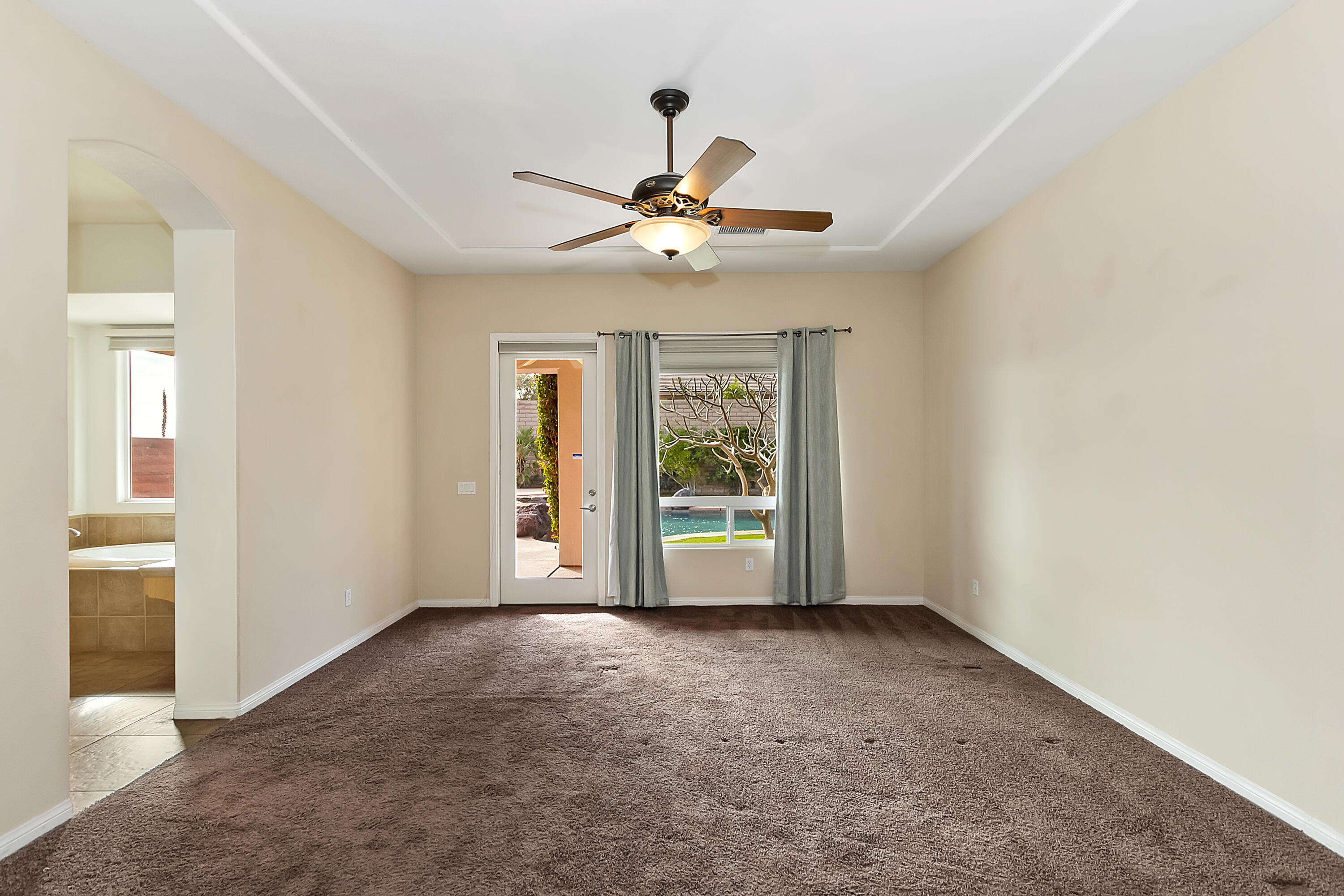 134 Via Tuscany Rancho Mirage, CA 92270 - Photo 27 of 44 a view of an empty room with a window